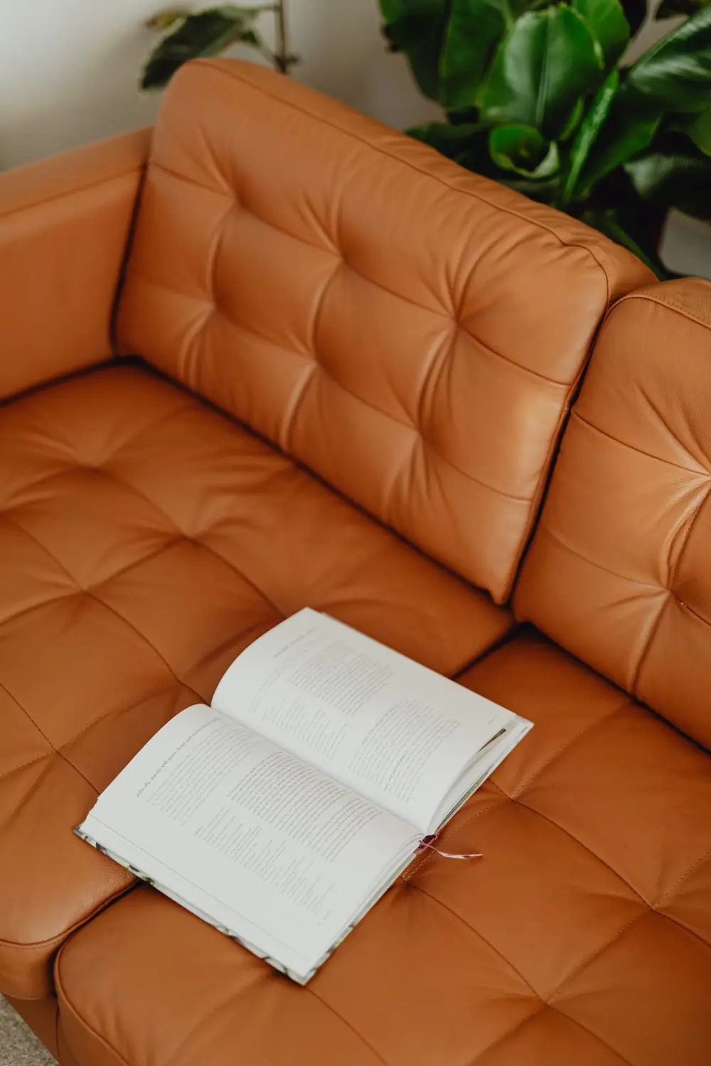 Tufted tan leather sofa